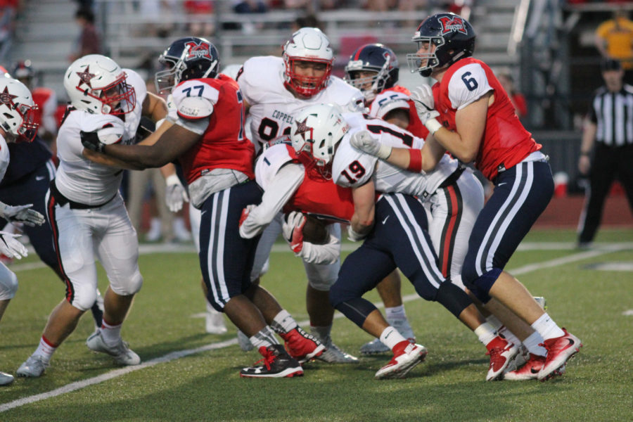 Senior Outside linebacker Tristan Kalina wraps up the ballcarrier in the backfield in Friday nights 31-21 victory at McKinney Boyd. Kalina made the game-sealing play, running back an interception on a screen pass 60 yards for a touchdown.