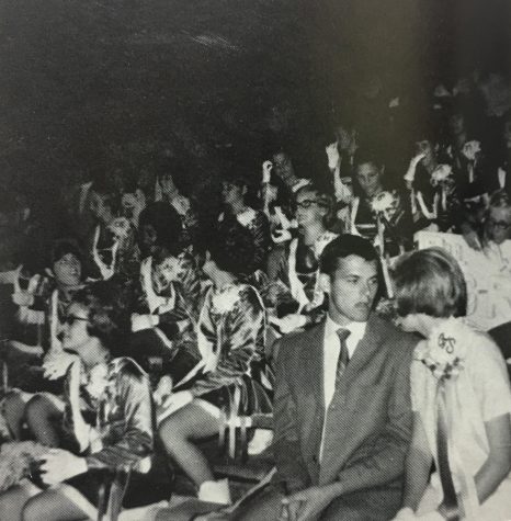 Coppell High School homecoming queen, Rory, chats with a friend in her bitesized mum at the homecoming game. Mums were attached to girls shirts with pins throughout the day during the 1970 festivities. Photo curtesy of Coppell Yearbook.