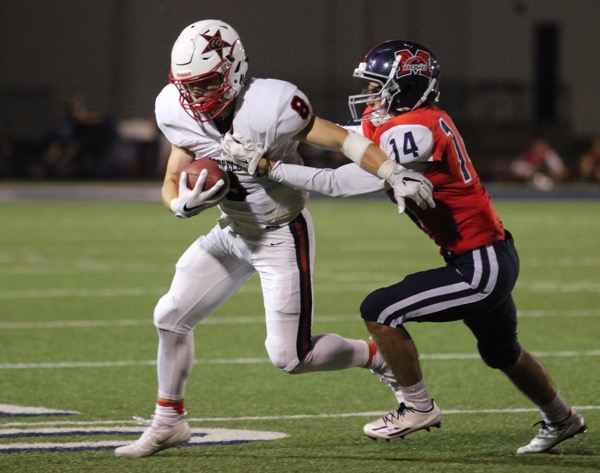 Coppell sophomore wide receiver Blake Jackson fights for yardage after a reception in Friday nights 31-21 victory at McKinney Boyd. The Cowboys came back in the second half and sealed the win with a late interception return for a touchdown by linebacker Tristan Kalina.