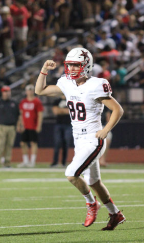 Senior long snapper Connor Choate pumps his fist after the Cowboys hit a field goal in their 31-21 win over McKinney Boyd. Choate had his hand in seven points, snapping for four extra points and one field goal.