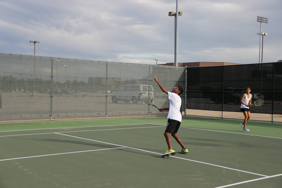 Arvind Arunachalam prepares to return the ball back to the Skyline opponent in his mixed doubles match.  Coppell won the match 8-0. Photo by Kelly Wei.
