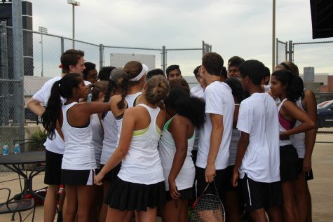 Coppell High School varsity tennis players huddle up and prepare for their match against Skyline High School on Tuesday. The Coppell Cowboys defeated Skyline, winning 19-0 in the Senior Night district matchup. Photo by Kelly Wei.