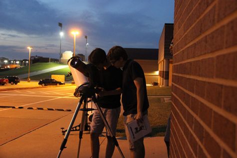 Coppell High School students look through  the telescope the science department has named ‘the Beast’ on Sept 21 in the CHS parking lot. Astronomy students taught AP Earth and Science students along with AP Environmental Science classess about different topics relating to the celestial sphere at Mrs. Barnes' Star Party.