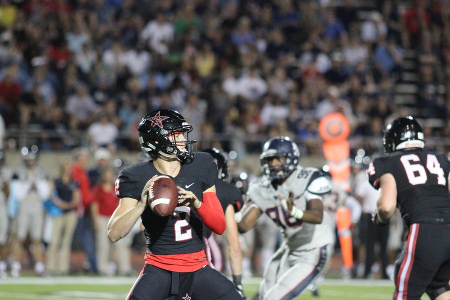Junior quarterback Brady McBride loads up to pass in the Cowboys 42-20 loss to Allen on Sept. 9 at home. Coppell football goes head-to-head against Jesuit this Friday. 