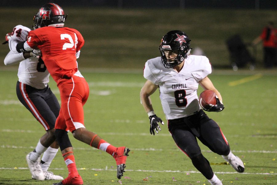 Sophomore+wide+receiver++Blake+Jackson+gets+past+a+Lake+Highlands+defender+in+the+Cowboys+52-10+victory+over+the+Wildcats+on+Friday+night.+In+the+win%2C+Jackson+again+led+Coppell+with+8+catches.