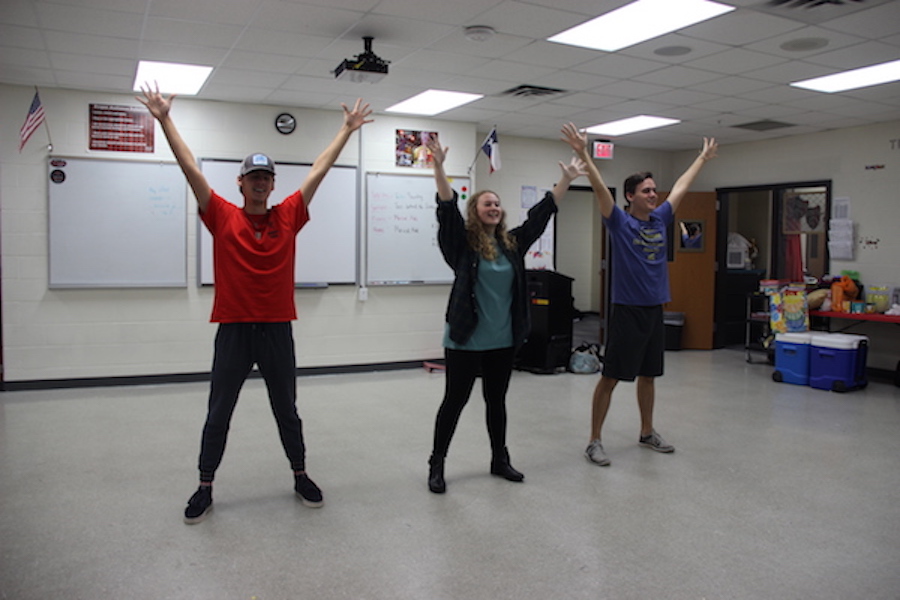Coppell High School seniors Jack and Ty Dalrymple practice their kickline song “Lullaby of Broadway” with senior Allison Davis during their fourth period theater class on Monday. This song is part of the theater’s ongoing show, 42nd Street. Photo by Hannah Tucker.