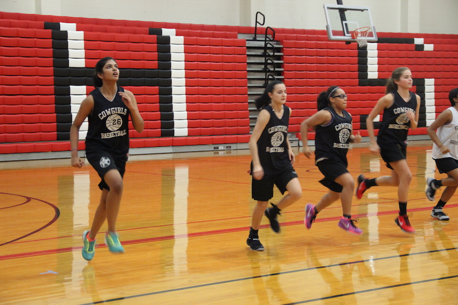 Coppell High School freshman Shrey Kottapatti runs down the court for warm up drill last Friday in the big gym. Kottapatti, who transferred to CHS from private Catholic school, The Highlands, and is now part of the Coppell Basketball team and is enjoying life at a bigger school. 