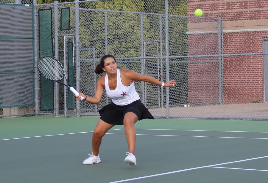 Senior tennis player Laila Kamel strikes the ball during her 4-6, 6-0, 10-7 doubles victory in Coppells win over Rowlett. Although Kamel and her partner Akshaya Kannan dropped the first set, they battled back to help the team sweep Roulette.
