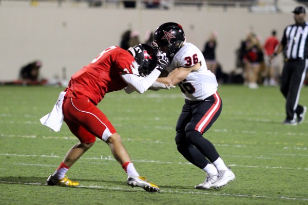 Coppell High School senior safety Skyler Seidman tackles one of the Wildcats offensive players during the third quarter of Friday night’s game at Lake Highland High School. The Coppell Cowboys claimed a 52-10 victory over the Lake Highlands Wildcats, moving to 2-1 in District 9-6A play. 
