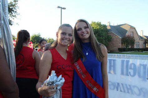  Coppell High School senior Brooke Davidson stands next to her twin sister, senior Christina Davidson, before the homecoming parade Wednesday afternoon. Brooke was a nominee for homecoming queen, which was announced Rohina Aslam at the football game. Photo by Hannah Tucker.
