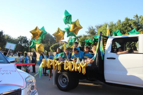 Valley Ranch Elementary students ride on their school’s happy birthday float before the homecoming parade near Cottonwood Creek Elementary on Wednesday afternoon. Many elementary schools participate in the parade to show off their school spirit. Photo by Hannah Tucker.