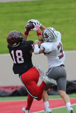 With minutes remaining in the second quarter, Coppell High School senior Matt Dorrity jumps to catch a pass from CHS junior Brady McBride. After a close matchup, the Round Rock Dragons defeated the Coppell Cowboys with a final score of 49-45 at WISD Stadium. 