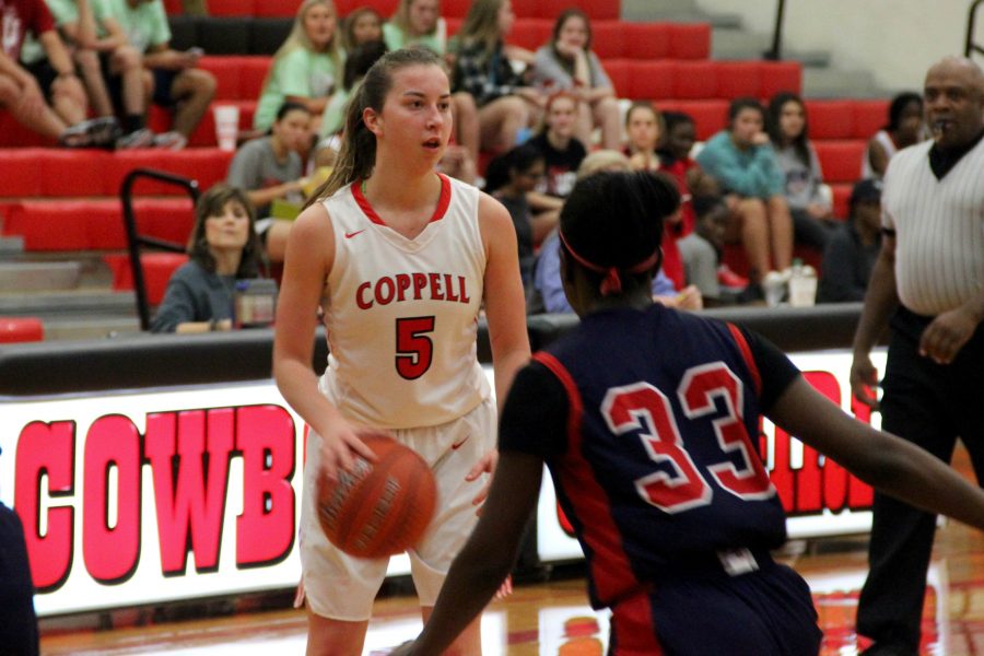 Coppell High School junior shooting guard Emma Johnson dribbles down the court, looking for an open teammate in last years matchup against Keller. Johnson Coppell with 10 points in Fridays loss to Denton Guyer.