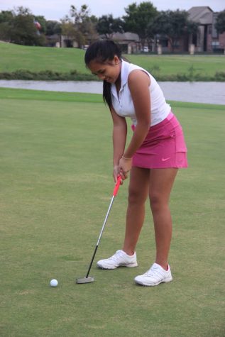 Coppell High School freshman Alyson Immanivong practices her swing on Wednesday at Riverchase Golf Course. Immanivong has been golfing for four years and is the only current freshman on the varsity golf team. 