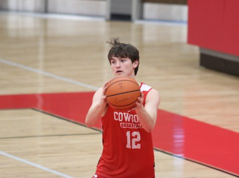 Coppell High School junior James Pietrowiak passes the ball during practice on Friday, Nov. 6 after school in the arena. The Cowboys won their season opener 64-54 against McKinney Boyd last Tuesday.