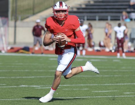 Coppell High School junior quarterback Brady McBride looks for a pass during the first quarter of Saturdays game at Buddy Echols Field. The Cowboys beat the Rowlett Eagles 27-20, which moves them onto the second round of playoffs.