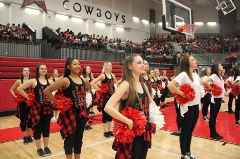 Coppell High School Lariettes cheer and keep up the spirit at the senior pep rally last Friday in the arena. They performed a hip hop dance during the rally to a mixture of songs including “Panda” by Desiigner and “Pop, Lock, & Drop It” by Huey. Photo by Hannah Tucker.