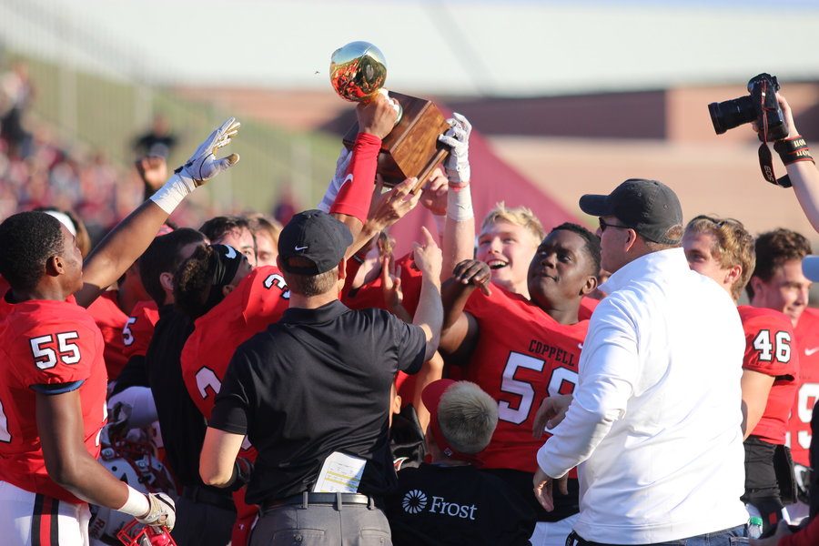 The Coppell High School varsity football team celebrates their Bi-District Region II Division I Championship on Saturday after defeating the Rowlett Eagles 27-20 at Buddy Echols Field.
