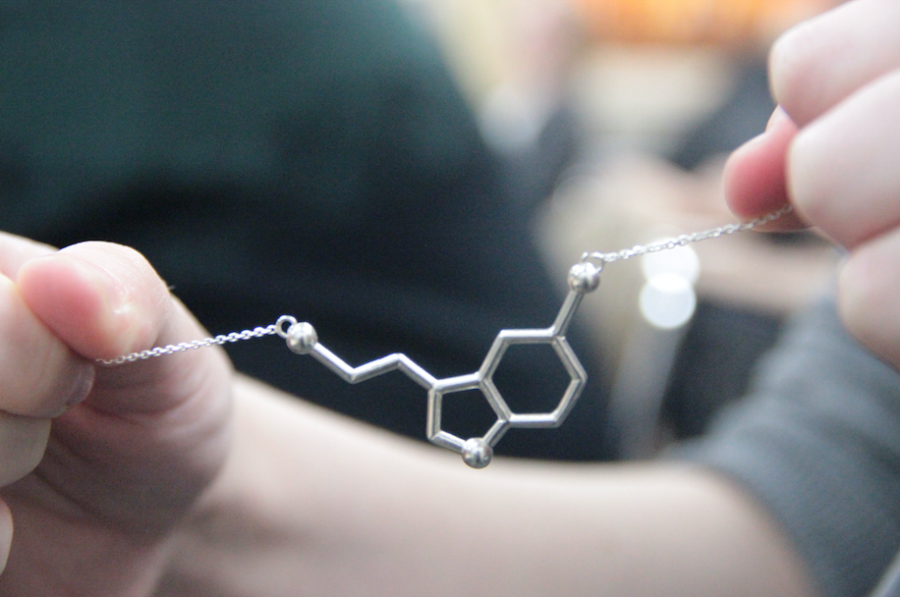 Doe wears a necklace in the shape of the chemical compound for happiness, serotonin. It is one of the many small ways Doe celebrates her journey to self-love and peace.