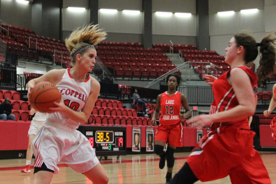 Junior guard Mary Luckett drives into the lane in Coppells 60-30 victory over Lake Highlands on Friday night. The Cowgirls got off on a tear to start the game, leading 14-0 midway through the first quarter.