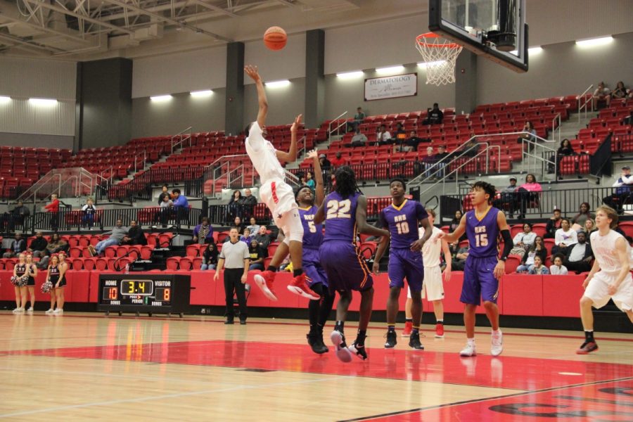 Coppell senior forward Christian Plummer shoots a running jumper over a Richardson defender in the third quarter to put Coppell ahead, 36-31. Plummer finished with 13 points in the Cowboys’ 58-47 win at the CHS arena on Friday night.