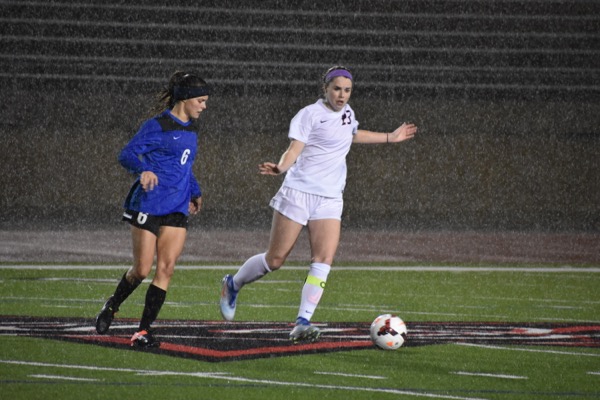 Coppell senior Sarah Houchin dribbles around Byron Nelson’s defense during the first half of Tuesday nights match at Buddy Echols Field. Coppell moved to 6-0 as they beat Byron Nelson, 1-0. Photo by Ale Ceniceros