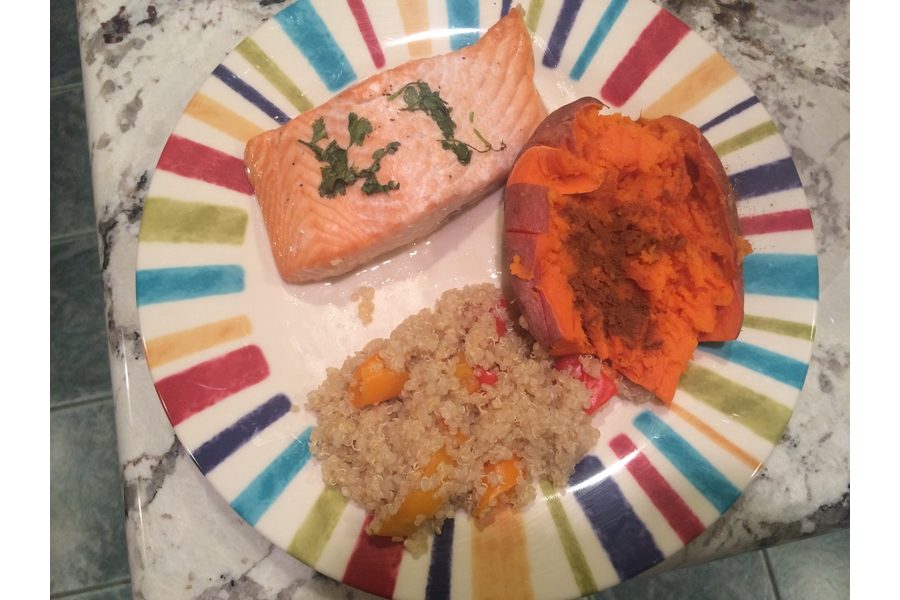 This simple and sweet salmon recipe with roasted red peppers and baked sweet potatoes can be completed in under an hour. This recipe uses only healthy ingredients and you can taste the difference. Photo by Aubrie Sisk.