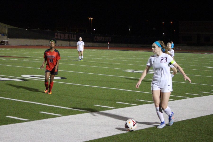 Coppell High School senior defender Sarah Houchin looks to pass to a teammate in the second half of Friday’s game against Cedar Hill at Buddy Echols Field. Houchin scored a goal in Coppell’s 4-0 win over the Longhorns.