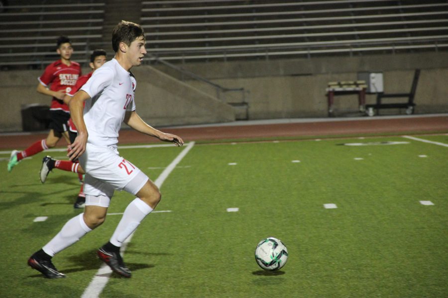 Coppell High School sophomore defender Jeremy Basso dribbles downfield against Dallas Skyline in District 9-6A action at Buddy Echols Field on Friday night. The Coppell varsity boys soccer team defeated Skyline 5-1.