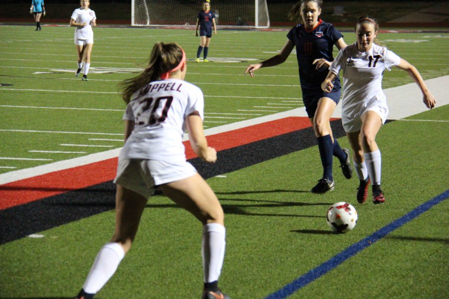 Coppell High School sophomore defender Haley Roberson dribbles up the sideline, looking to pass to sophomore forward Micayla Weathers. The Cowgirls tied Richardson Pearce,1-1, at Buddy Echols Field on Tuesday night.