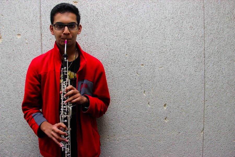 Coppell High School junior Mihir Chadaga plays the english horn in a CHS band practice room on Wednesday afternoon. Chadaga has been playing the english horn since last year. Photo by Amelia Vanyo.