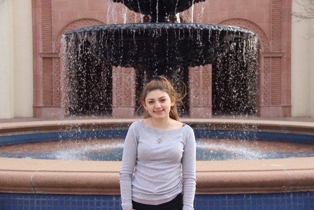 Coppell High School senior Daniela Gil de Ieyva poses in front of the fountain at St. Ann Catholic Parish. Gil de Ieyva has developed a passion for ministry work through involvement in her church. Photo by Amanda Hair. 
