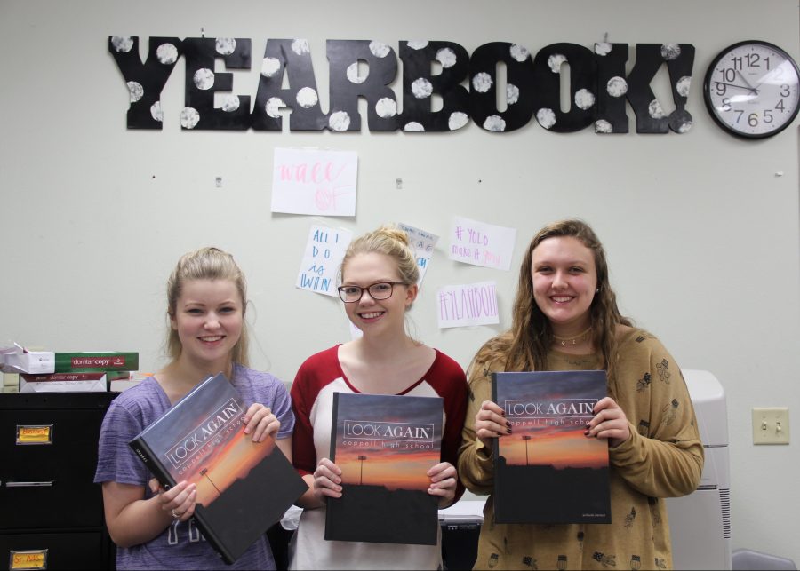 Coppell High School senior editors of the Round-Up yearbook (left) Catherine Carter, (middle) Erin Dempsey and (right) Mckenzie Hosier showcase the award winning 2016 yearbook with theme “Look Again.” They were part of the 2016 yearbook team that won three marks of distinction in the areas of coverage, writing, editing, photography and rank of First Class by the National Scholastic Press Association. 