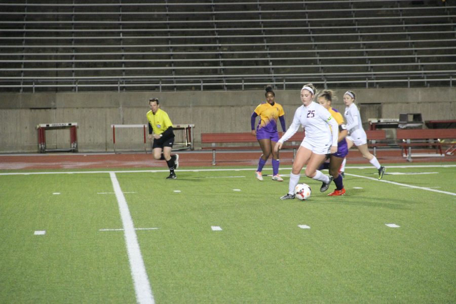 Coppell+junior+forward+and+Arkansas+commit+Tyler+Runnels+possesses+the+ball+in+the+Cowgirls+5-0+win+over+Richardson+on+Tuesday+night.+The+Cowgirls+extended+their+winning+streak+to+13.+Photo+by+Chloe+Navarro.