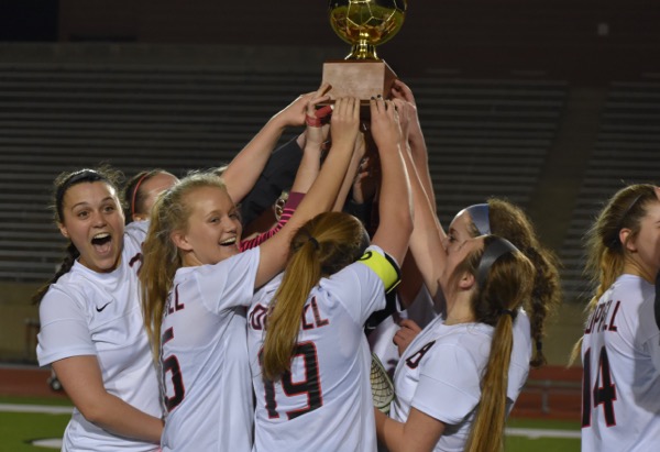 The Coppell High School soccer team celebrates their District 9-6A championship after last nights win at Buddy Echols Field. The Coppell Cowgirls beat the Skyline Raiders 13-0 to clinch the District 9-6A championship. 