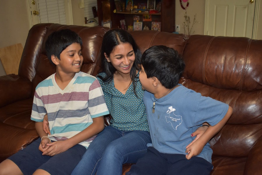 Coppell High School senior Soundarya Daliparthy’s strong relationship with her twin brothers Sreeram (left) and Kartheek (right) influences her to pursue a career in speech pathology. Drawing inspiration from experiences with her autistic brother Kartheek, Daliparthy looks forward to aiding others in developing effective communication. Photo by Jessica Jun.