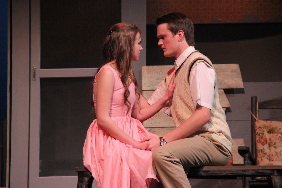 Coppell High School senior Seth Holst leans in to kiss junior Macy Johnson when she stops him on stage during the CHS Theater Department’s play “Picnic” in the auditorium Thursday night. Holst plays the role of Alan Seymour, current boyfriend to Johnson’s character, Madge Owens. 