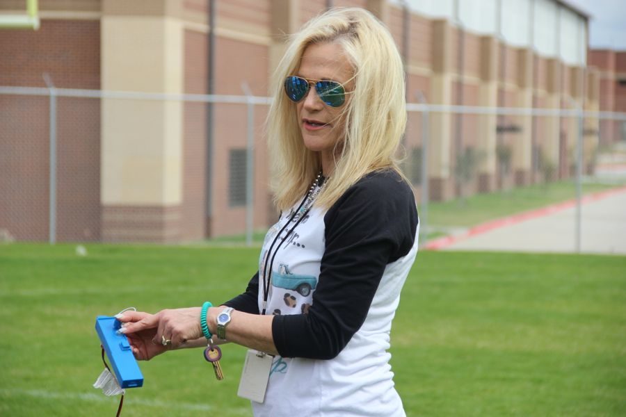 Coppell High School physics teacher Donna Murrell explains to students how to correctly launch the rocket during fifth period on Thursday. Physics classes are experimenting with rockets to understand the concept of momentum and torque. 
