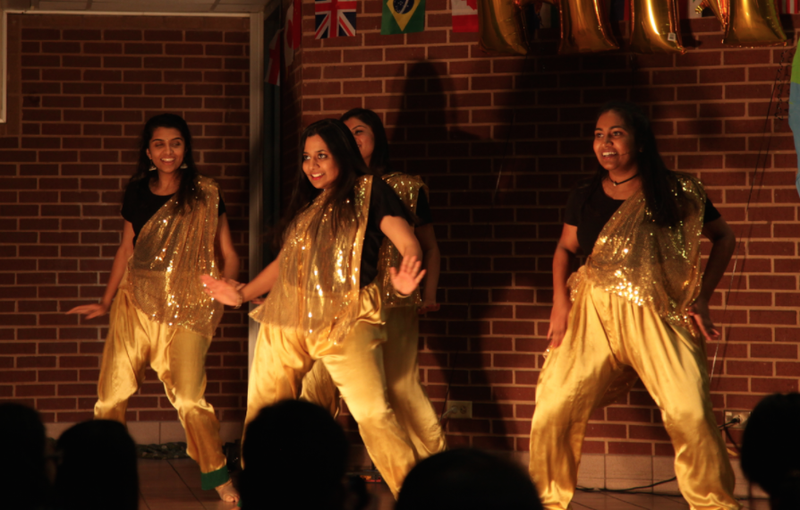 Students+Bollywood+dance+during+the+Coppell+High+School+Junior+World+Affairs+Council+%28JWAC%29+annual+Heritage+Night+on+Friday++in+the+CHS+commons.+From+hip-hop+to+bollywood+dancing%2C+the+night+of+performances+aims+to+celebrate+the+cultural+and+ethnic+diversities+present+in+the+CHS+student+body+through+music+and+dance.+Photo+by+Kelly+Wei.