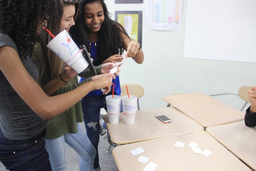 Freshman students Cierra Hargraves, Kalena Jones, and Shravani Dangety in Coppell High School Algebra I teacher Marie Flynn’s classroom show parents a practice activity they performed in class during the 2017 CHS Spring Showcase. The student-led parent night from 5-6:30 p.m. offered an inside look at many CHS classrooms.