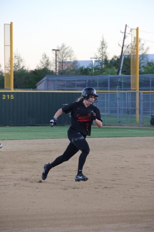 Coppell High School junior infielder Logan Kegley steals third base during Friday night’s game against Bishop Lynch at the CISD Baseball/Softball Complex. The Coppell Cowgirls won the game 15-0.