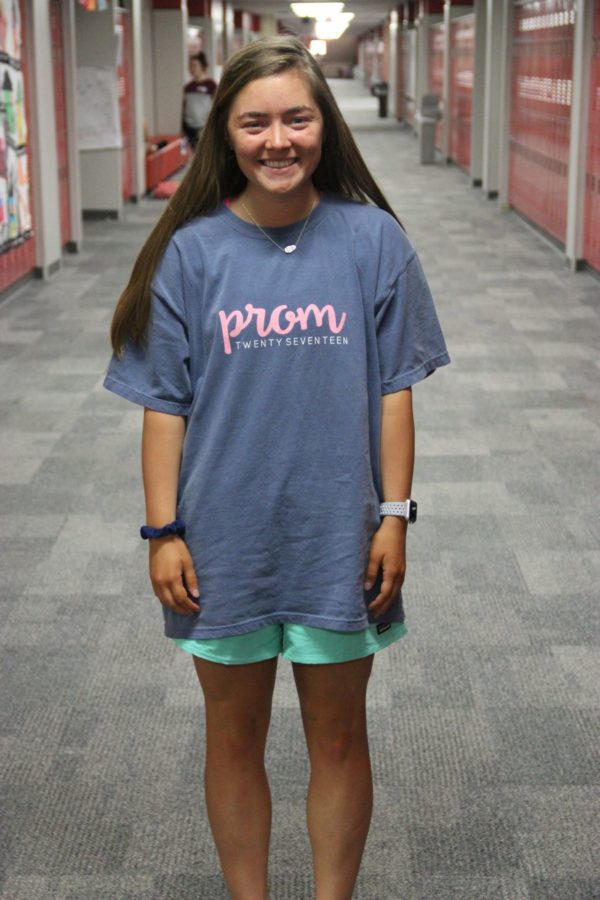 Coppell High School senior Tatum Brown shows off her 2017 prom shirt on Friday as part of the tradition at CHS. The CHS prom will be held on Southport Ranch on April 22.
