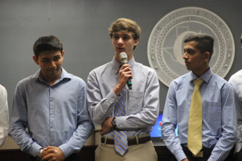 Coppell High School Track Coach Nicholas Benton’s Academic All-State qualifiers were recognized at Monday nights Board of Trustees meeting. Boys track All-State qualifier Evan Harr introduces himself to the packed room in the Vonita White Administration Building.
