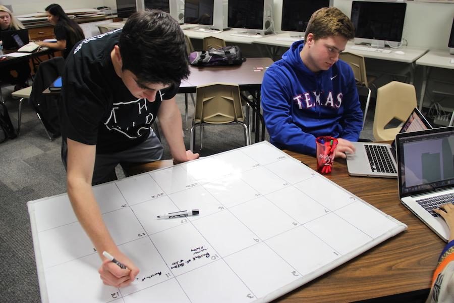 Junior editors Joseph and Marcus Krum work on the sports game schedule in their newspaper in Feb. 2016. Marcus is the Executive Sports Editor for the 2016-2017 school year, while Joseph is the Executive Enterprise Editor.