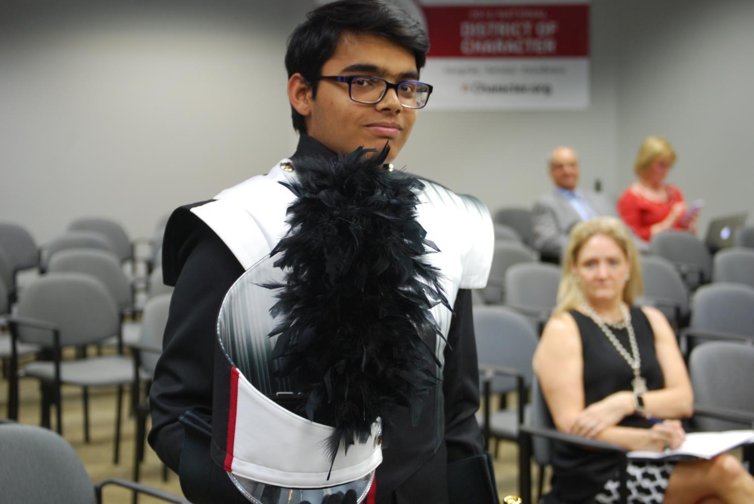 Coppell High School junior Aditya Bhavikati models the new band uniforms approved during the CISD Board of Trustees meeting Monday night. The Board also approved the purchase of three new buses during the meeting.