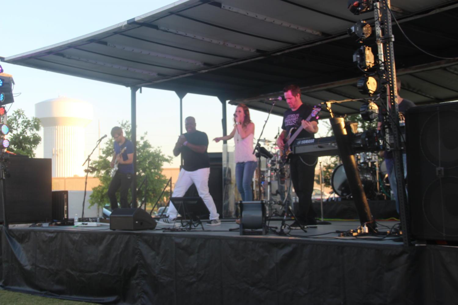 Last night, the band Time Machine sings covers of songs at the Coppell Concert on the Lawn in the Square at Old Town Coppell. Songs it performed ranged from “Uptown Funk” by Bruno Mars to “La Vida es un Carnaval” by Celia Cruz.