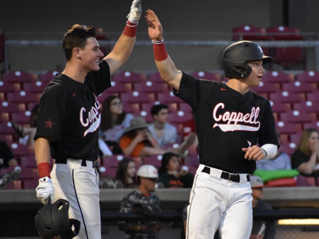 Coppell High School senior Cody Masters and sophomore Blake Jackson celebrate during the first inning of Friday nights game against the Naaman Forest Rangers. Coppell defeated the Rangers 16-1 at the AirHogs Stadium to move on to the next round of playoffs.