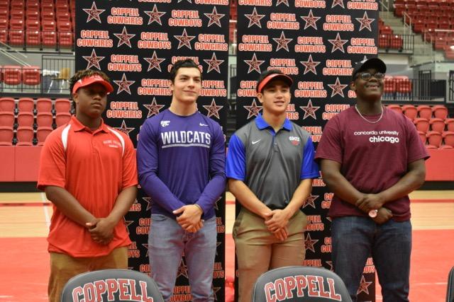 Coppell High School senior football players Chris Green, Bernardo Rodriguez, Matt Dorrity and Isaac Colter celebrate their signings on Monday in the CHS arena. Today 12 seniors signed to their designated colleges with the support of their family and friends.