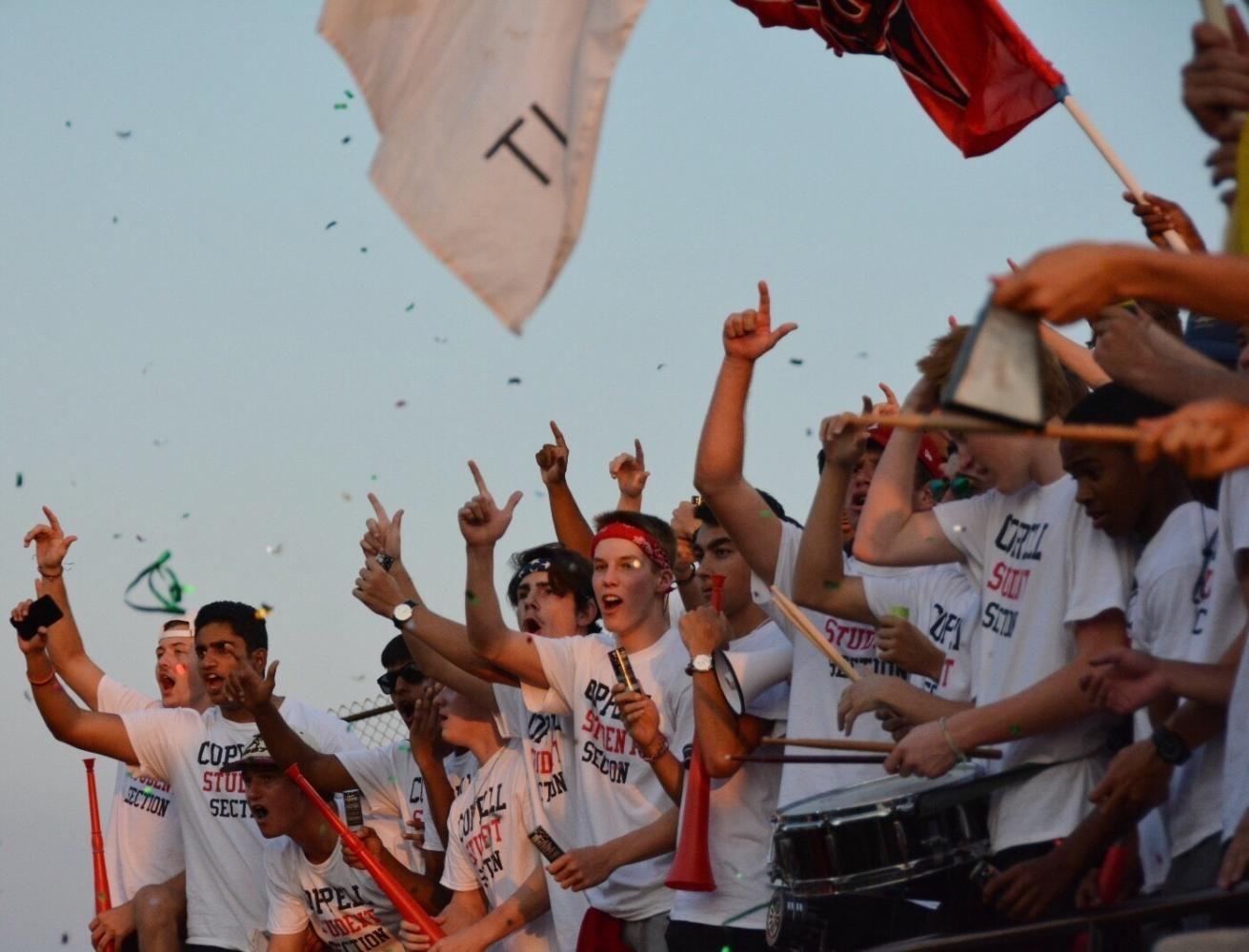 The+Coppell+Student+Section+showers+the+field+with+confetti+and+the+sound+of+cow+bells+as+they+cheer+on+the+Coppell+Cowboys+at+HEB+Pennington+Field+on+Sept.+1.+Many+Coppell+Students+dress+up+in+funny+costumes%2C+such+as+dinosaurs%2C+teletubbies+and+hotdogs%2C+as+the+Cowboys+defeated+L.D.+Bell%2C+58-23.