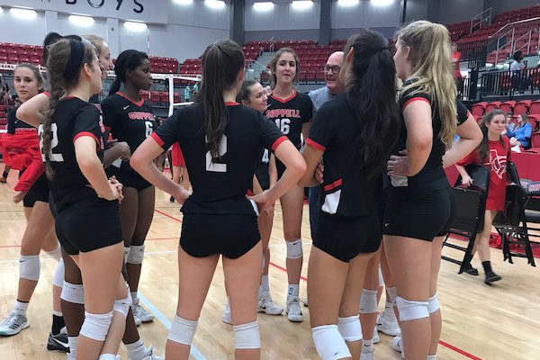 Coppell Cowgirls get in a huddle after Friday nights game in the arena. The Cowgirls defeated the Longhorns in three sets, 25-2, 25-4, and 25-3.